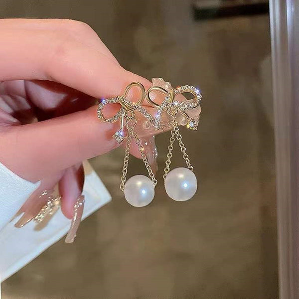 Bow pearl tassel long earrings